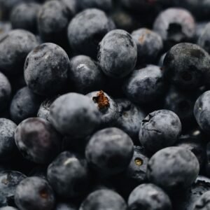 A detailed close-up of ripe blueberries showcasing their vibrant color and texture.