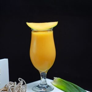 Vibrant mango smoothie served in a glass, perfect for a healthy refreshment.